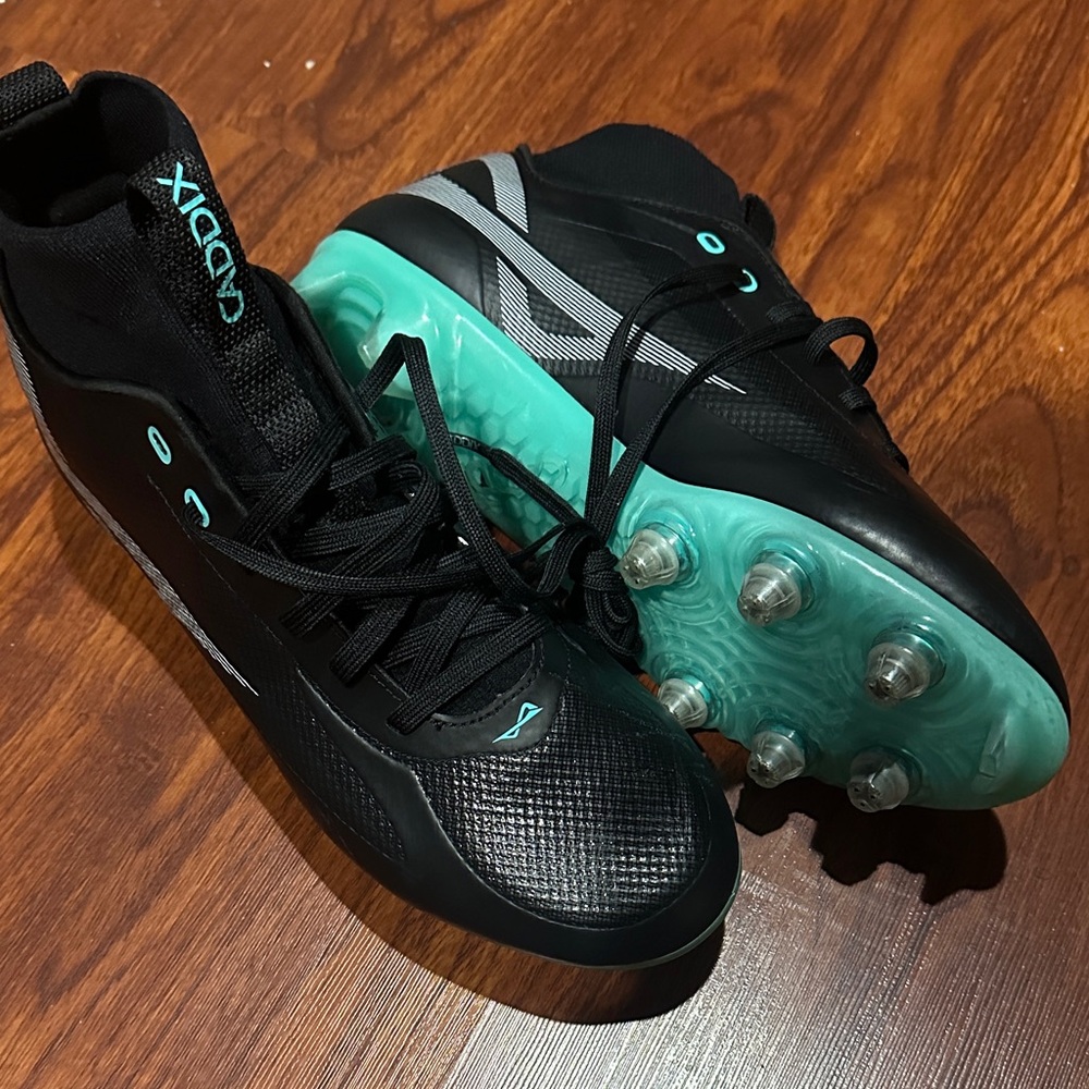 Caddix Black and Aqua Cleats